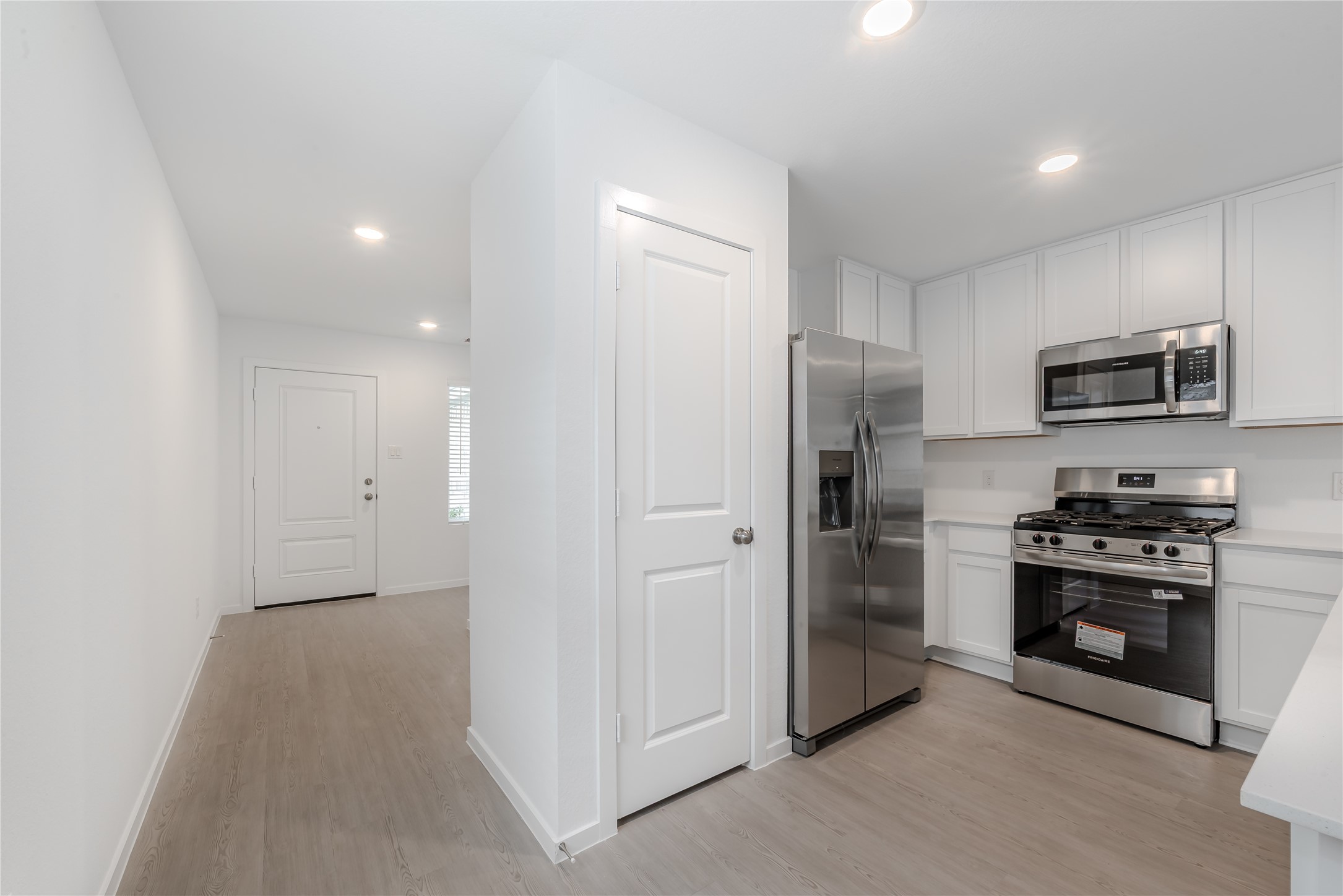 21358 Offida Lane New Caney, TX 77357 - Photo 7 of 26 a kitchen with stainless steel appliances granite countertop a refrigerator and a stove top oven