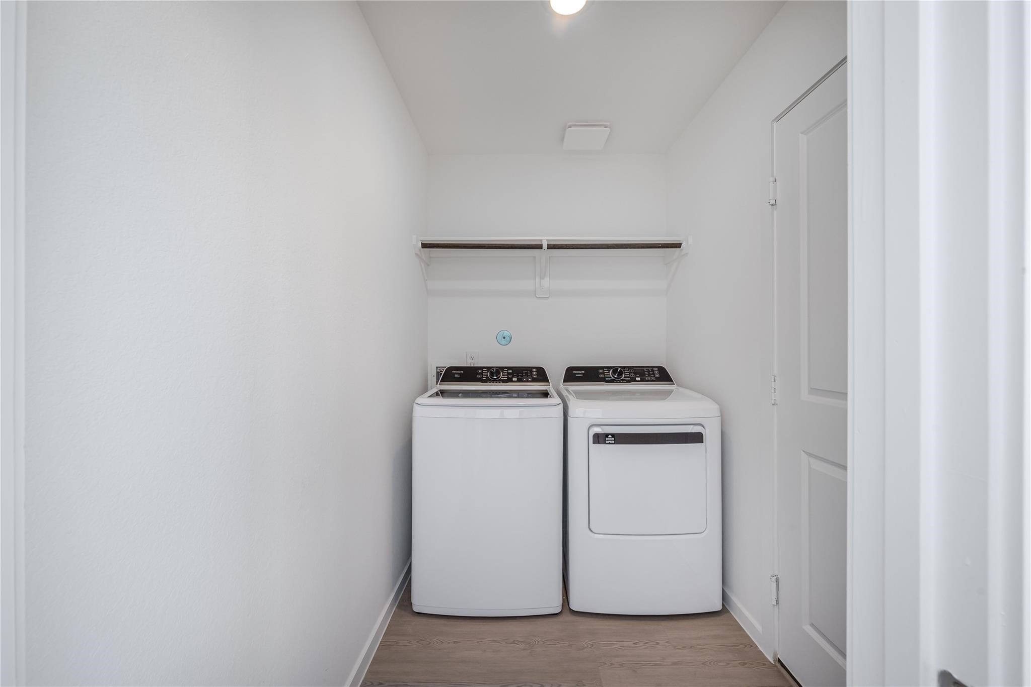 21358 Offida Lane New Caney, TX 77357 - Photo 10 of 26 a utility room with dryer and washer