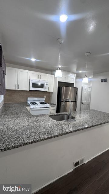 6013 Belden Street Philadelphia, PA 19149 - Photo 12 of 26 Modern kitchen with sleek finishes.