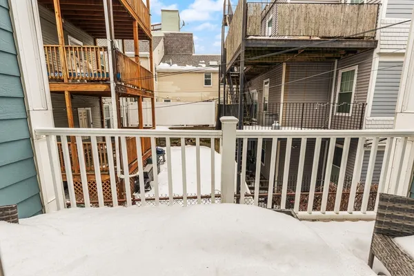 a view of a house with wooden fence