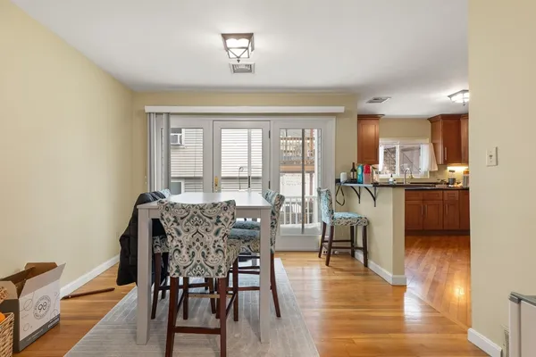 a view of a dining room with furniture window and wooden floor
