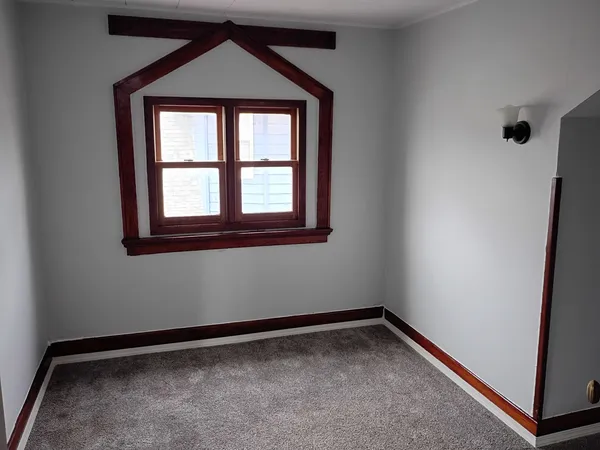 a view of empty room with windows