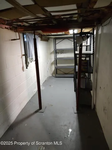a toilet sitting in a kitchen next to a sink