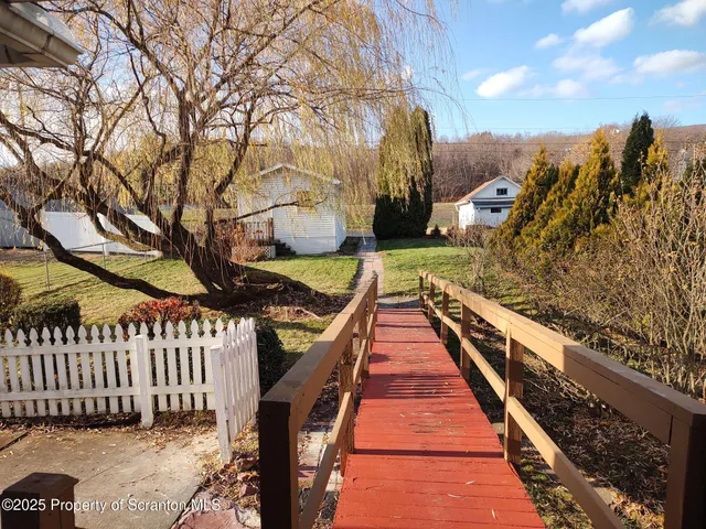 a front view of a house with wooden stairs