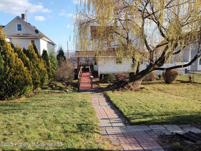 a view of a backyard of the house