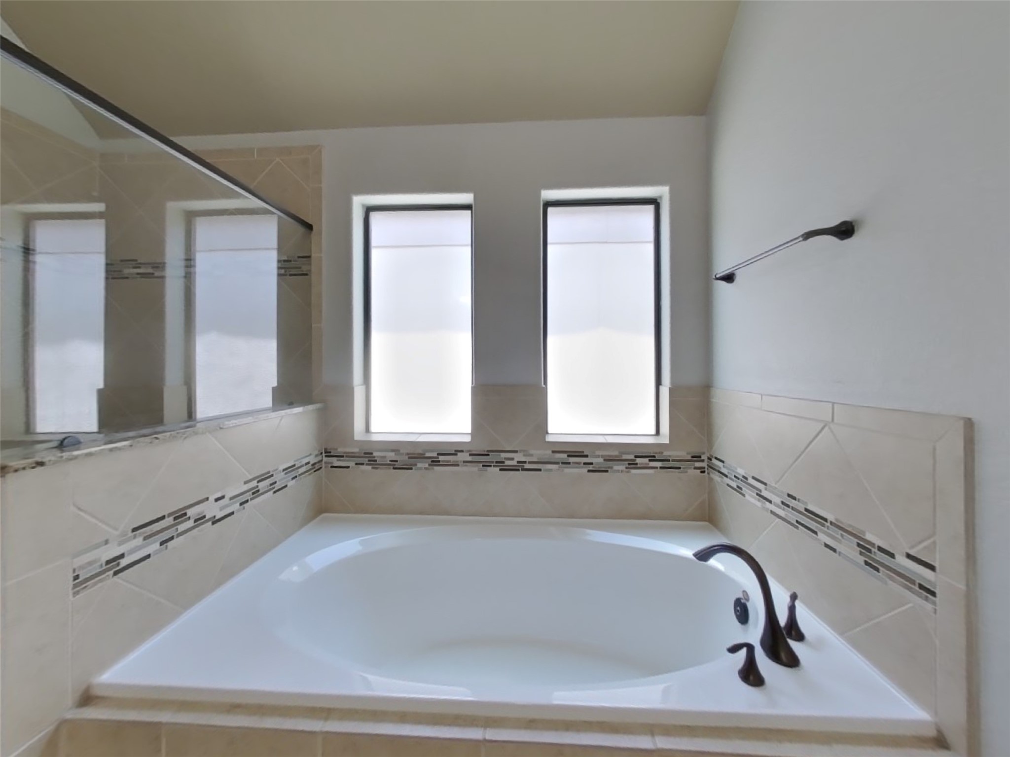 1819 Jara Court Spring, TX 77388 - Photo 9 of 19 a bathroom with bathtub and window