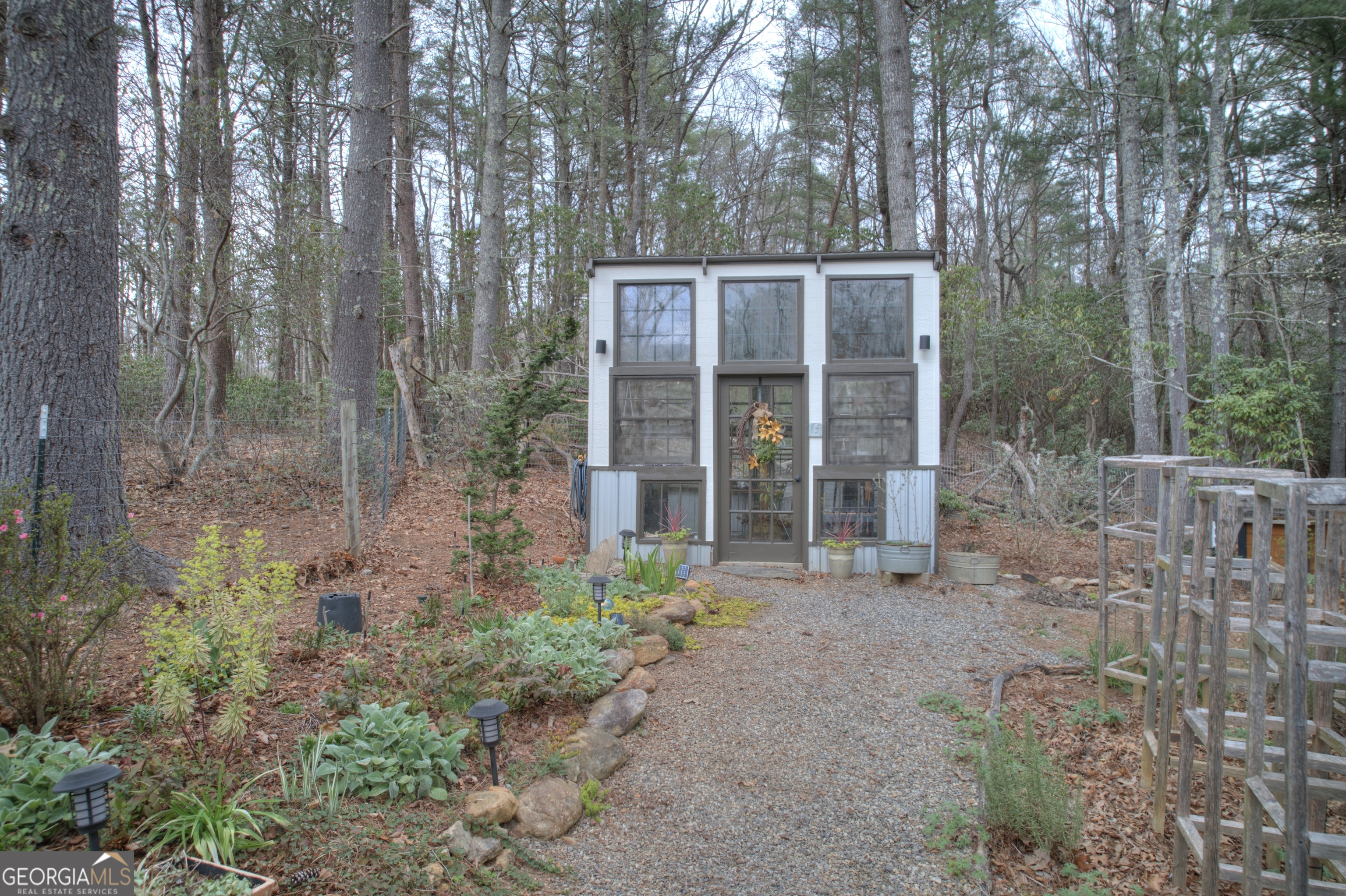 199 Oak Ridge Drive Blairsville, GA 30512 - Photo 25 of 107 a view of a house with a yard and potted plants