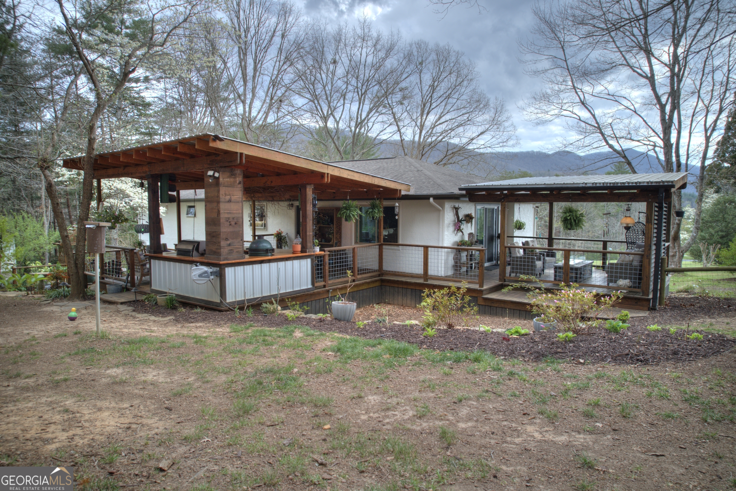 199 Oak Ridge Drive Blairsville, GA 30512 - Photo 26 of 107 a view of a house with backyard and sitting area