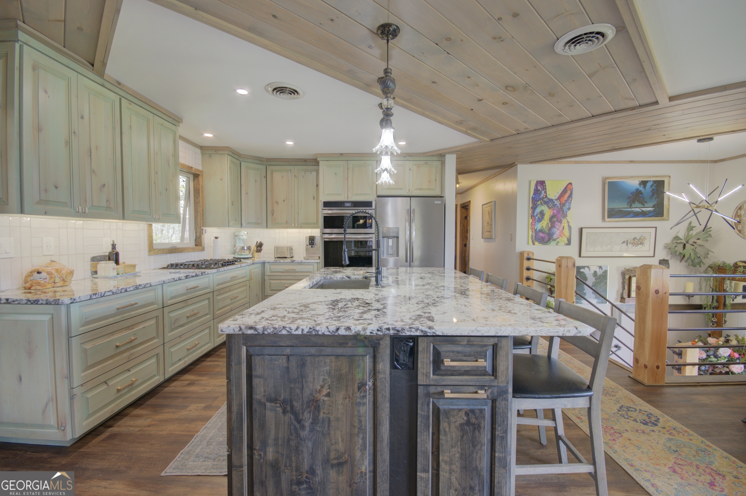 199 Oak Ridge Drive Blairsville, GA 30512 - Photo 54 of 107 a kitchen with stainless steel appliances granite countertop a sink and cabinets