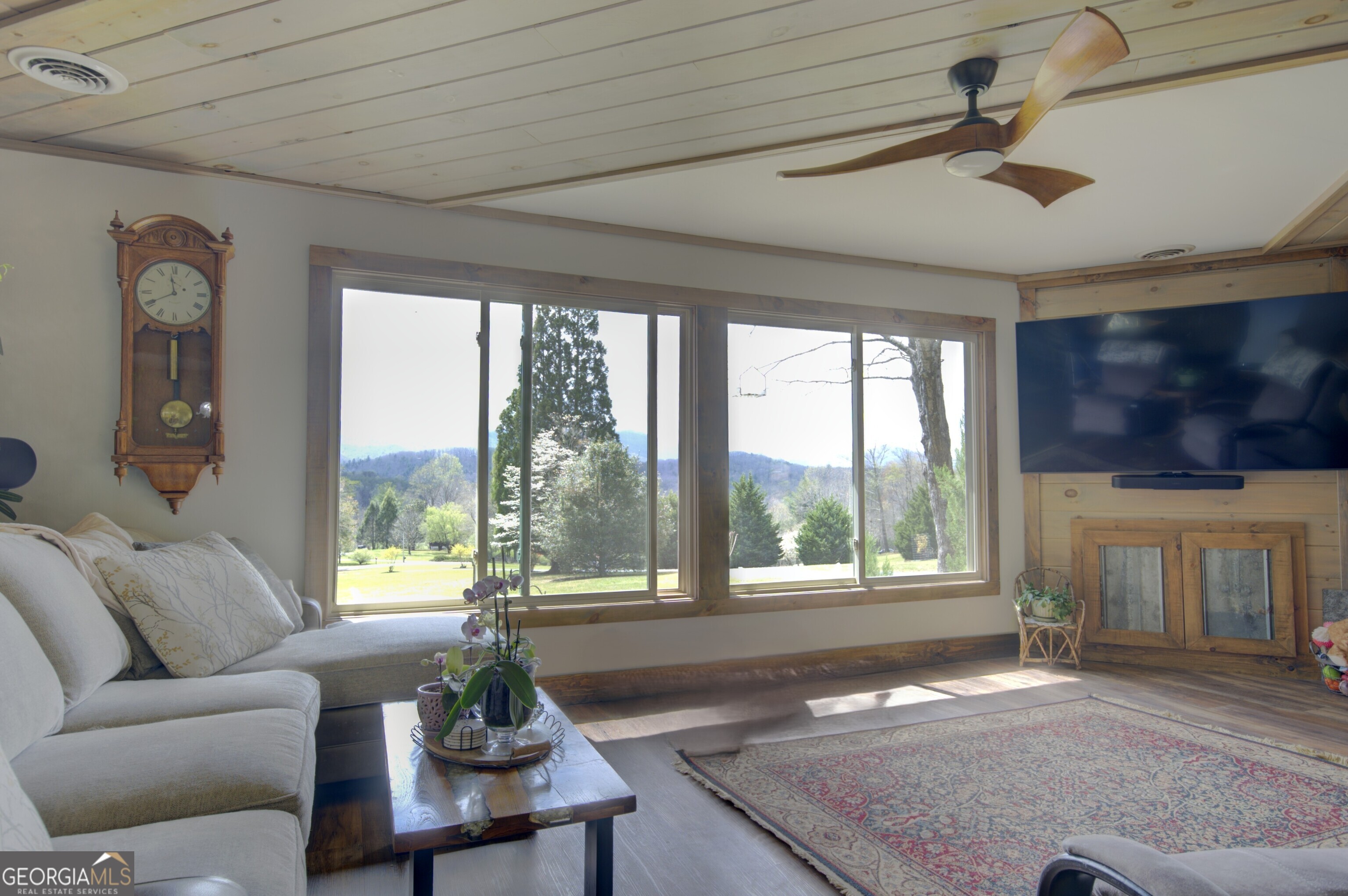 199 Oak Ridge Drive Blairsville, GA 30512 - Photo 63 of 107 a living room with furniture and a flat screen tv