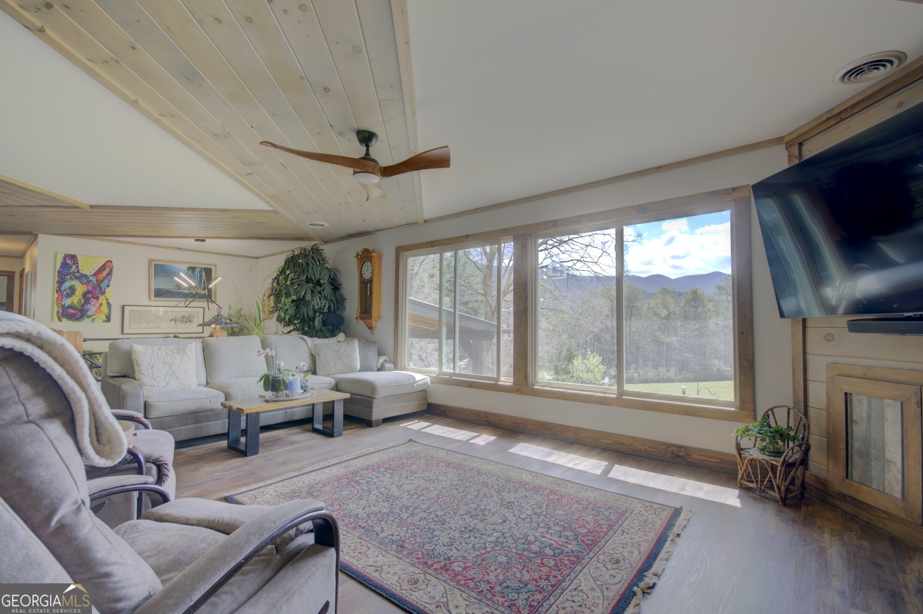 199 Oak Ridge Drive Blairsville, GA 30512 - Photo 65 of 107 a living room with furniture and a floor to ceiling window