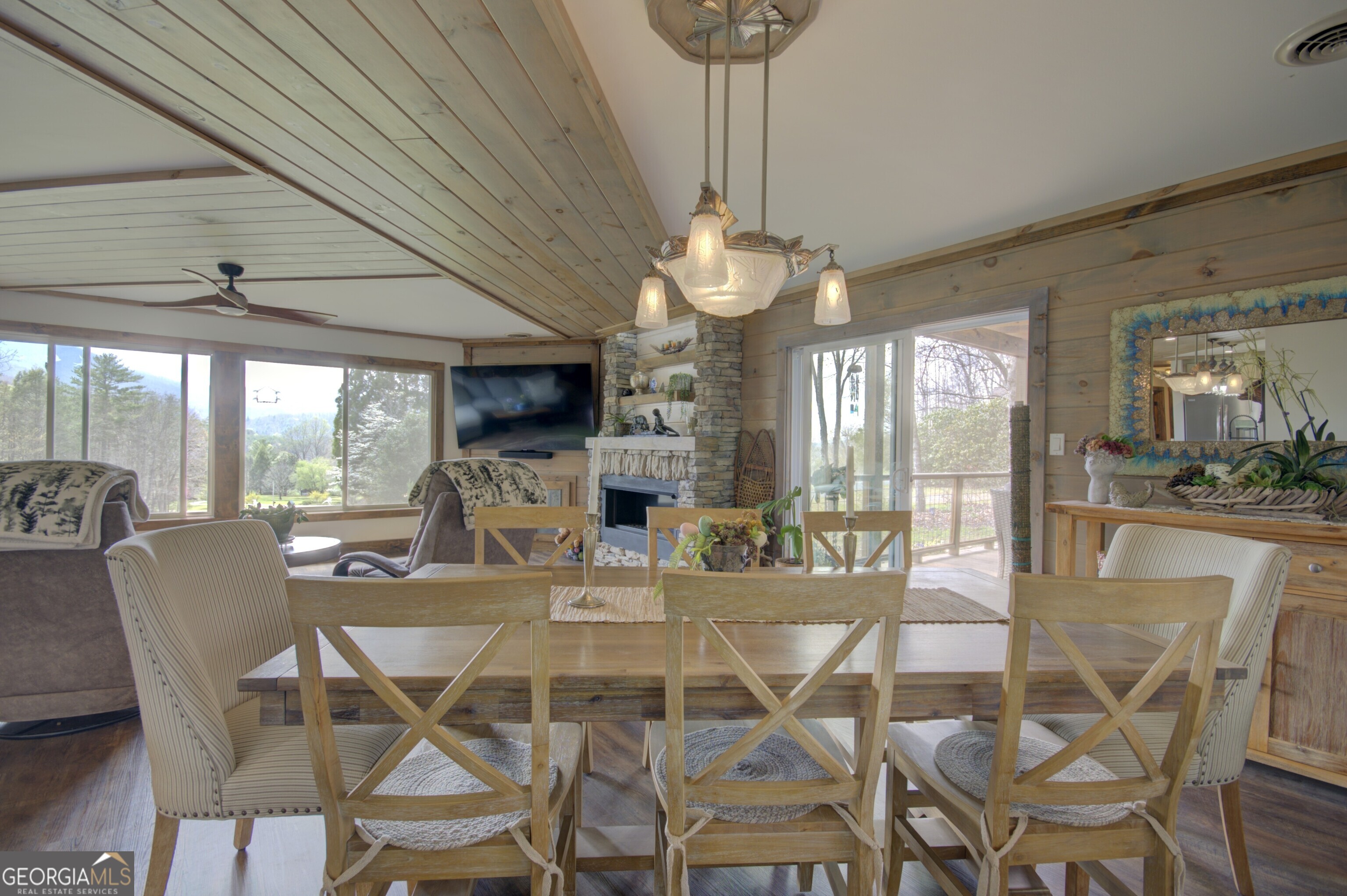 199 Oak Ridge Drive Blairsville, GA 30512 - Photo 70 of 107 a view of a dining room with furniture wooden floor and chandelier