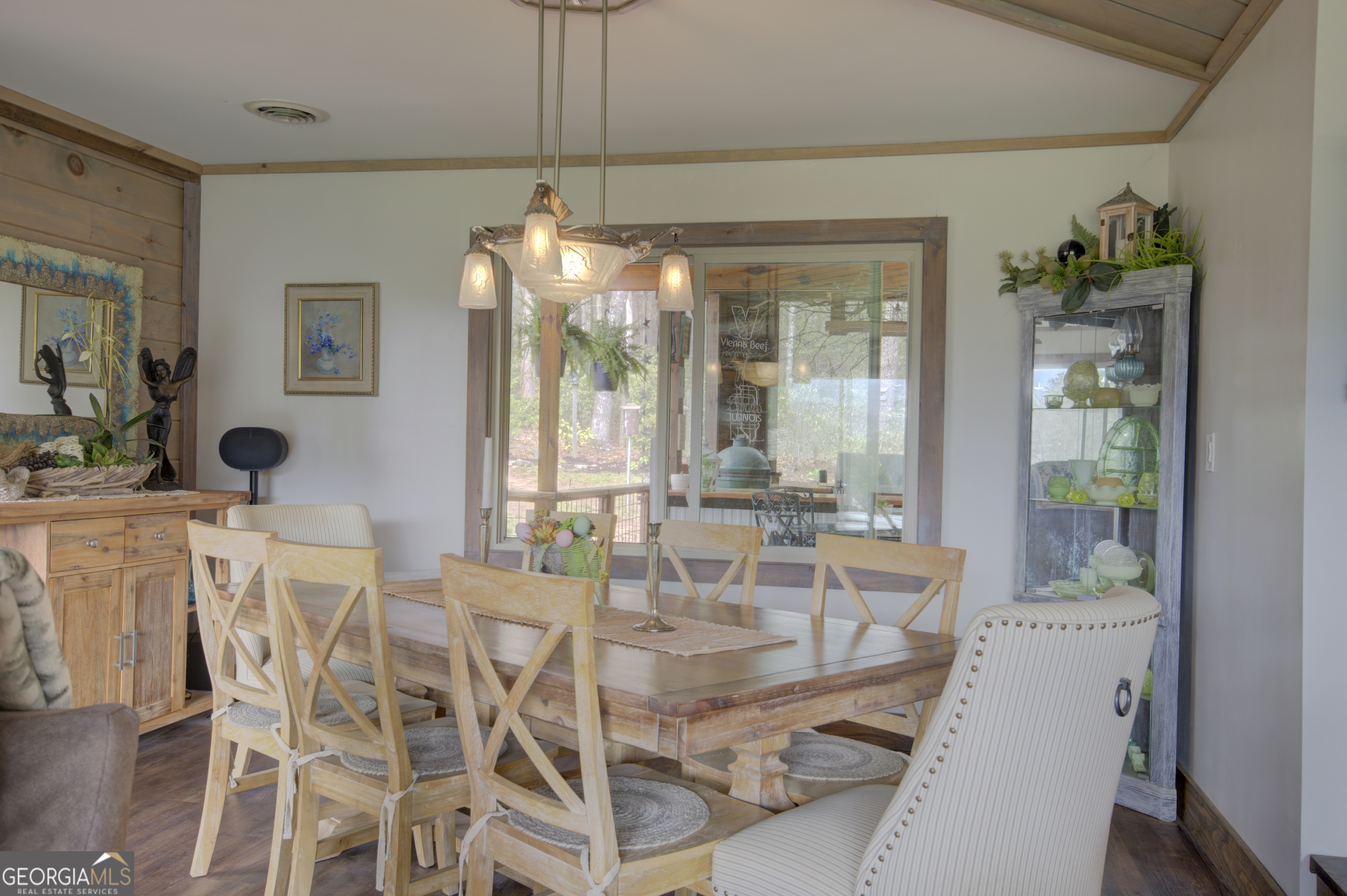 199 Oak Ridge Drive Blairsville, GA 30512 - Photo 72 of 107 a dining room with furniture a chandelier and wooden floor