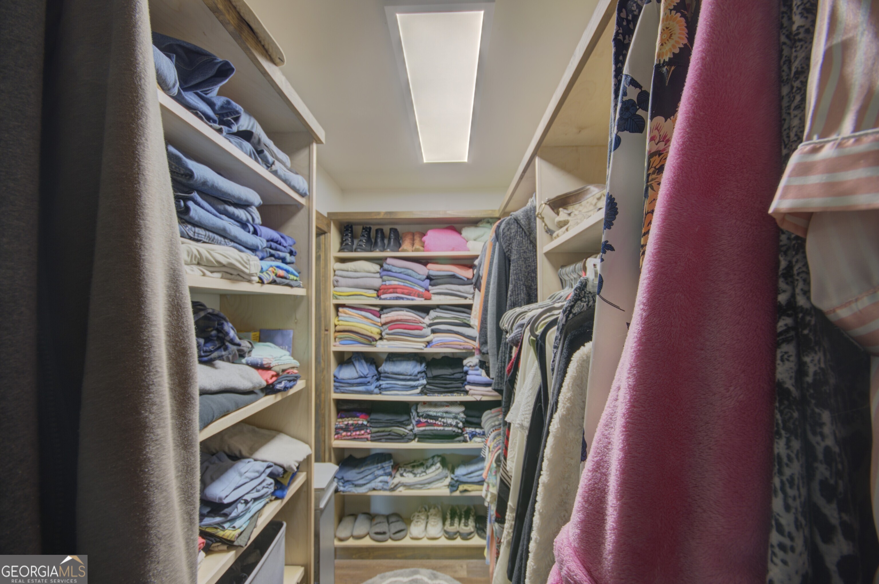 199 Oak Ridge Drive Blairsville, GA 30512 - Photo 84 of 107 a view of walk in closet with clothes and shoes