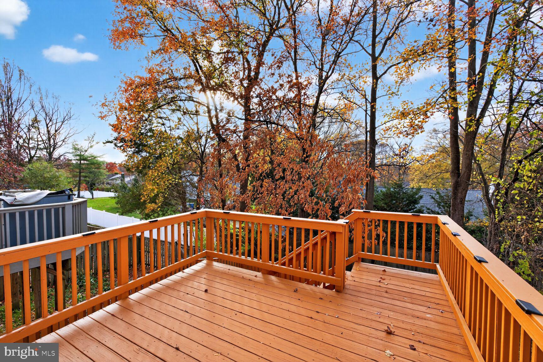 7310 Eggar Woods Lane Springfield, VA 22153 - Photo 12 of 29 a view of wooden deck and a yard
