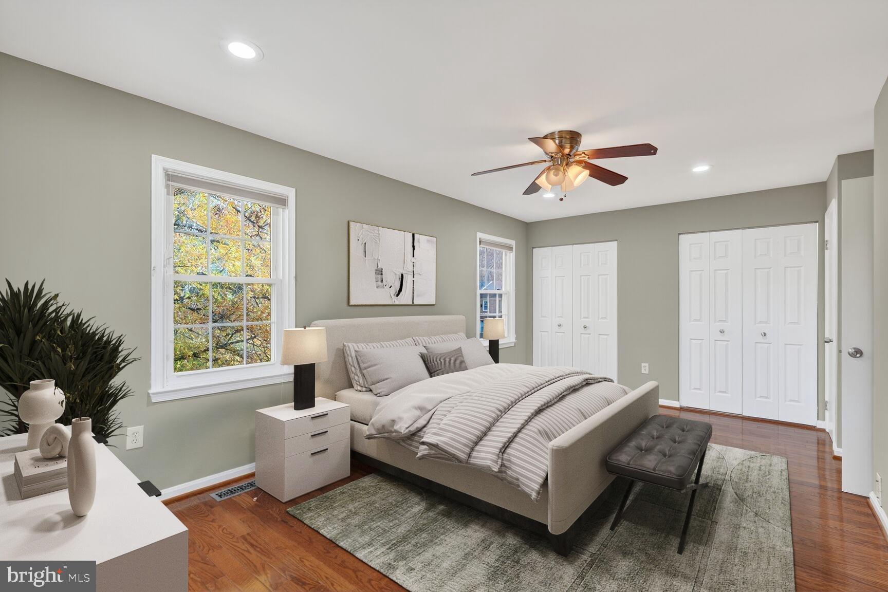 7310 Eggar Woods Lane Springfield, VA 22153 - Photo 19 of 29 a bedroom with a bed and a potted plant