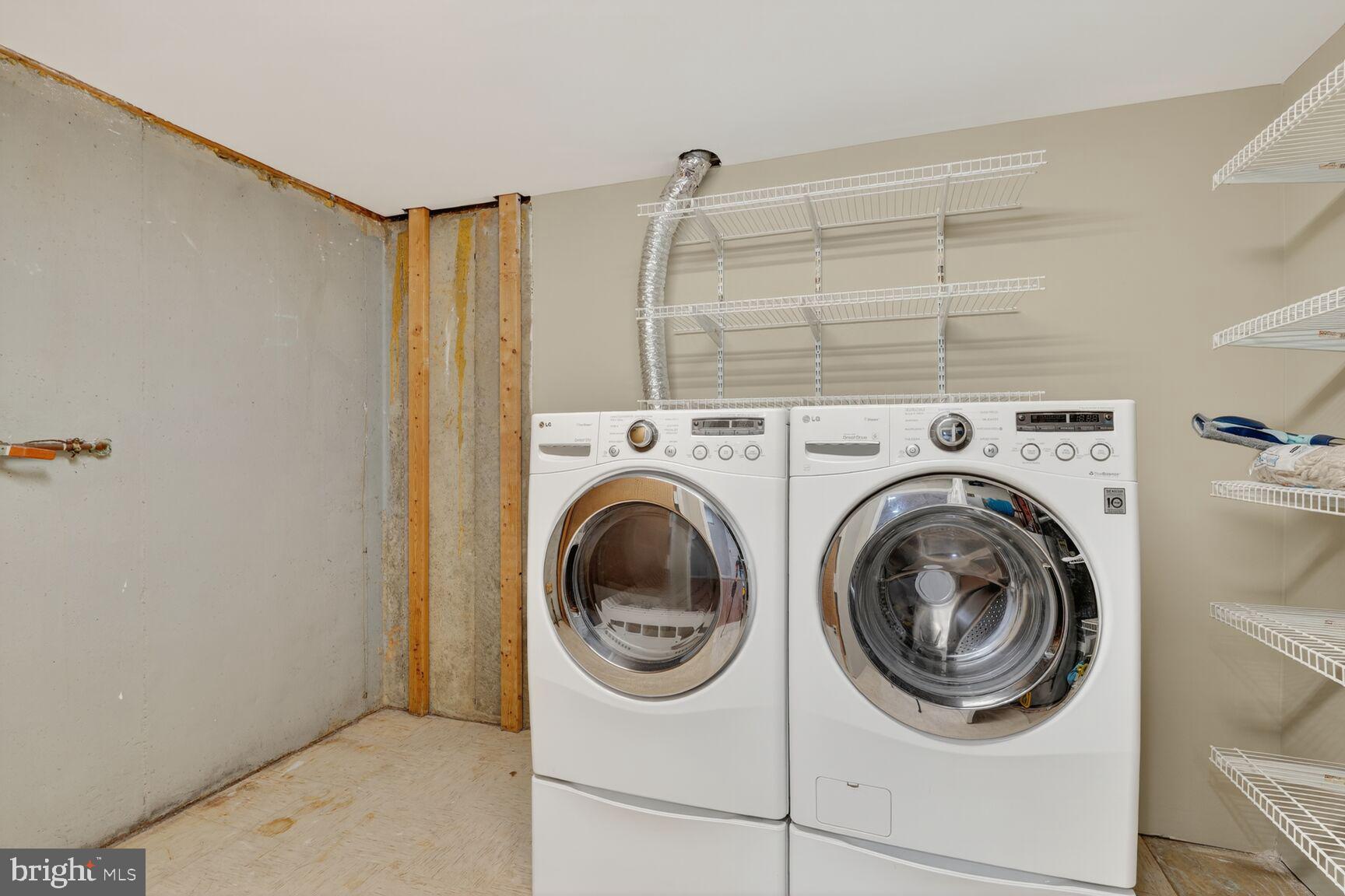 7310 Eggar Woods Lane Springfield, VA 22153 - Photo 22 of 29 a utility room with dryer and washer