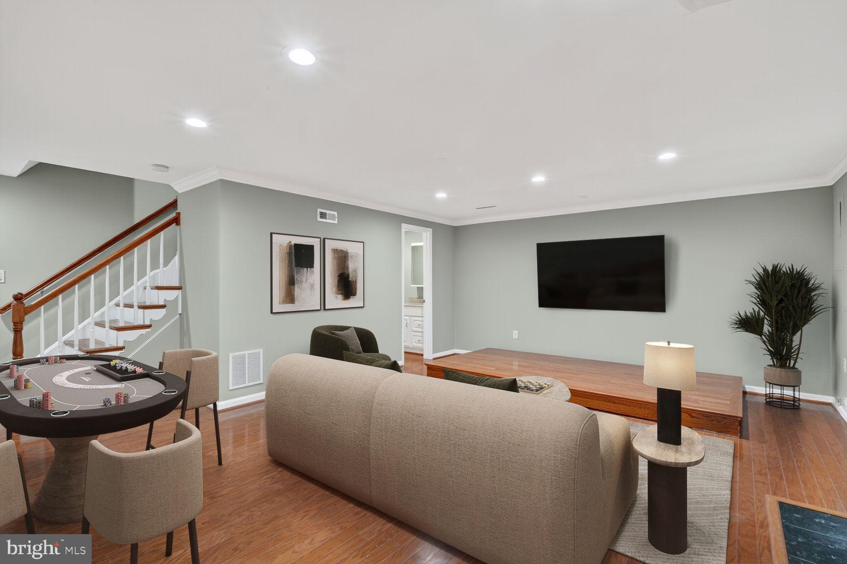 7310 Eggar Woods Lane Springfield, VA 22153 - Photo 24 of 29 a living room with furniture and a flat screen tv