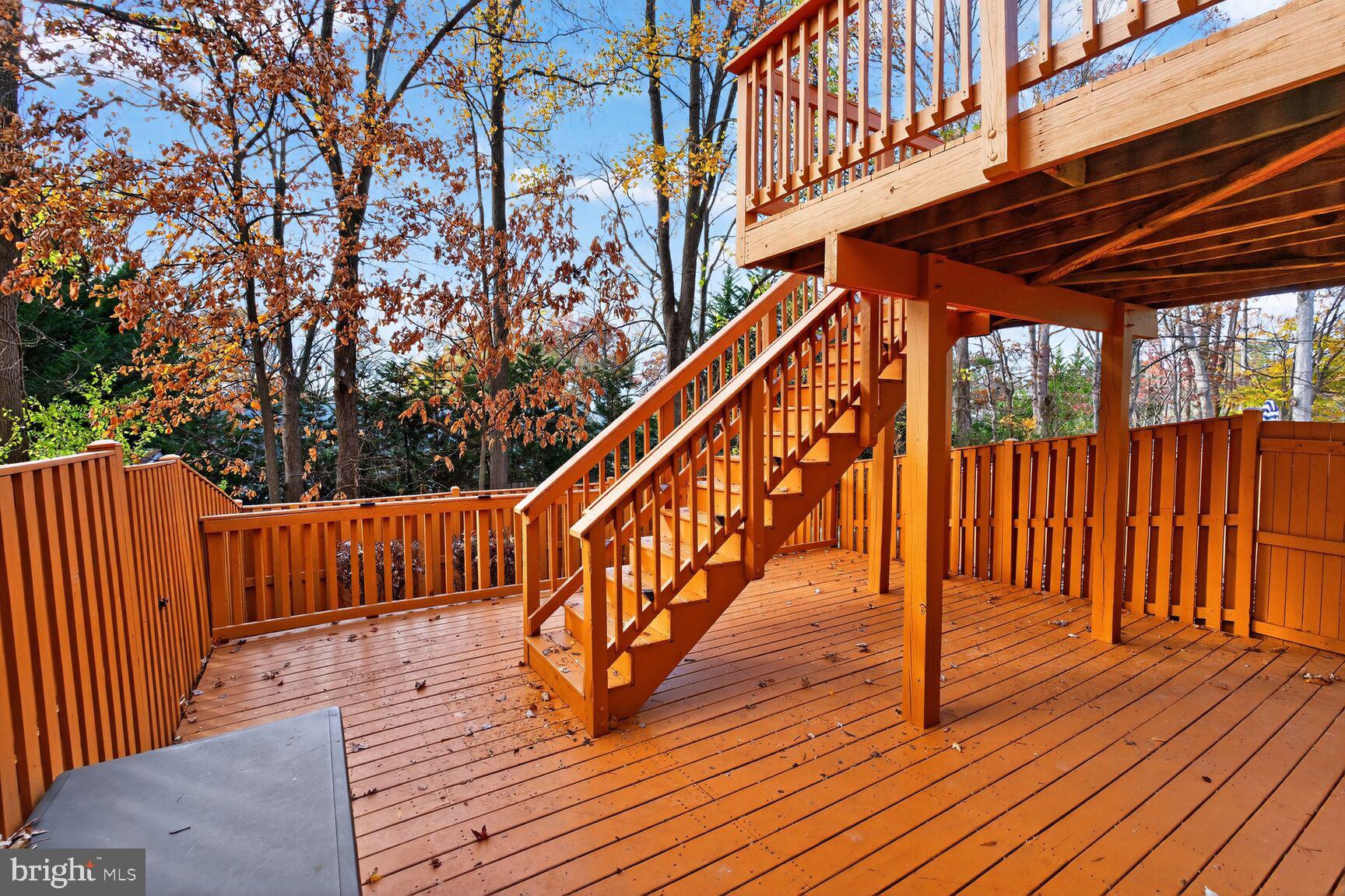 7310 Eggar Woods Lane Springfield, VA 22153 - Photo 27 of 29 a view of deck with wooden floor and outdoor seating