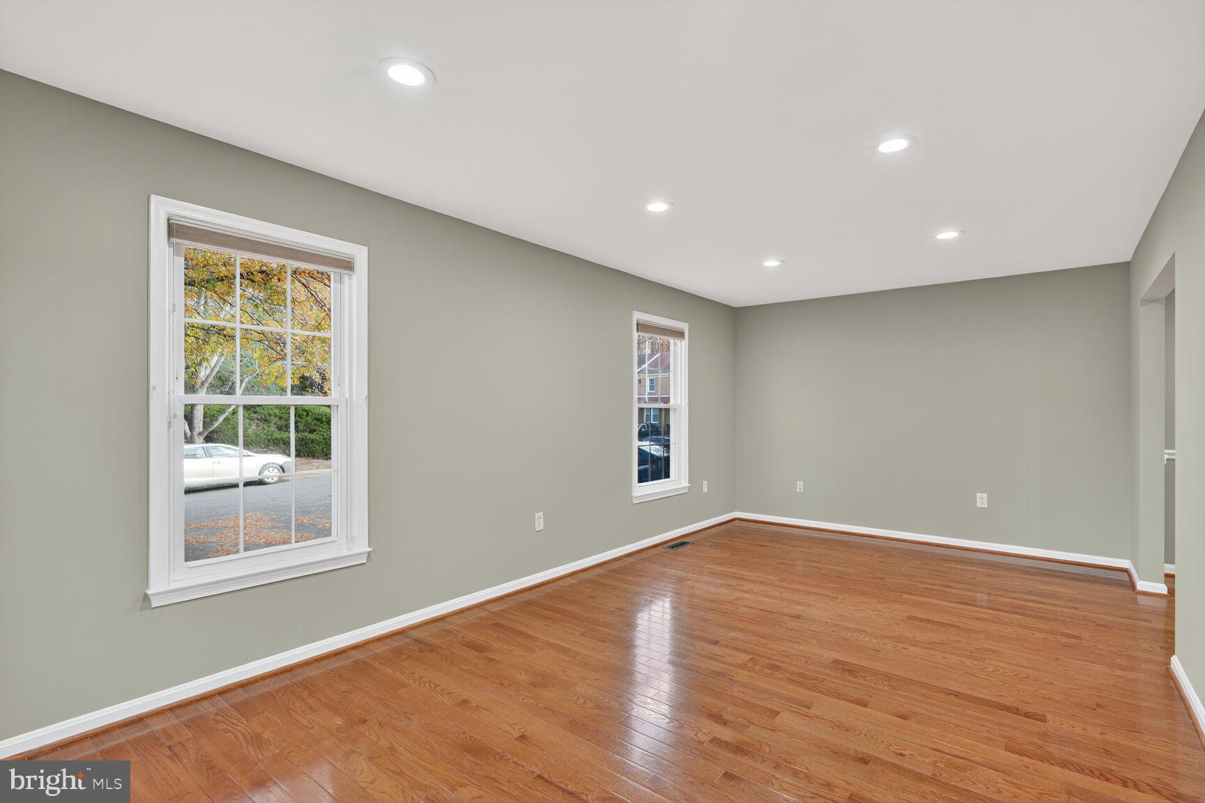 7310 Eggar Woods Lane Springfield, VA 22153 - Photo 3 of 29 a view of empty room with wooden floor and fan