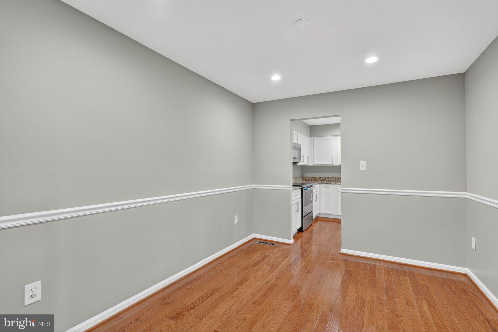 7310 Eggar Woods Lane Springfield, VA 22153 - Photo 5 of 29 a view of a room with wooden floor and gym equipment