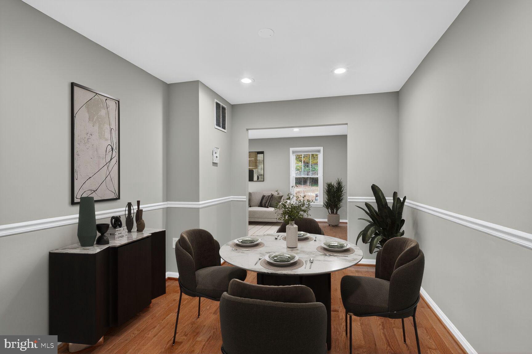7310 Eggar Woods Lane Springfield, VA 22153 - Photo 6 of 29 a view of a dining room with furniture and wooden floor