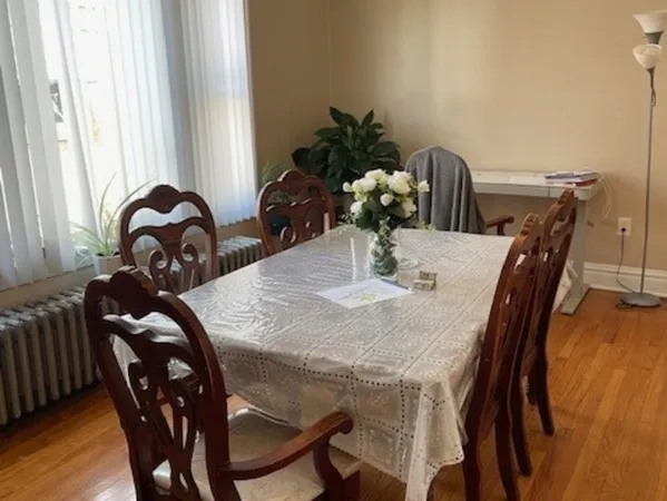 a view of a dining room with furniture and window