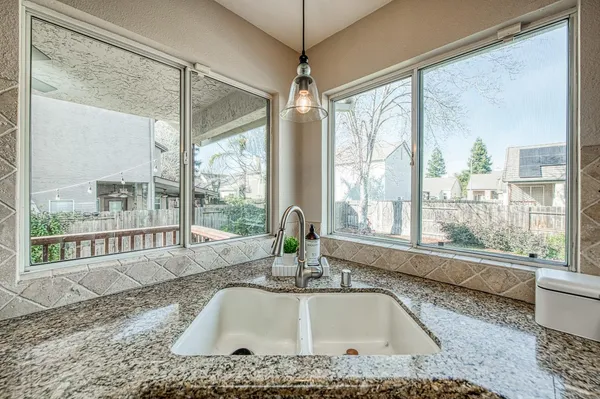 a view of a dining room with furniture window and outside view