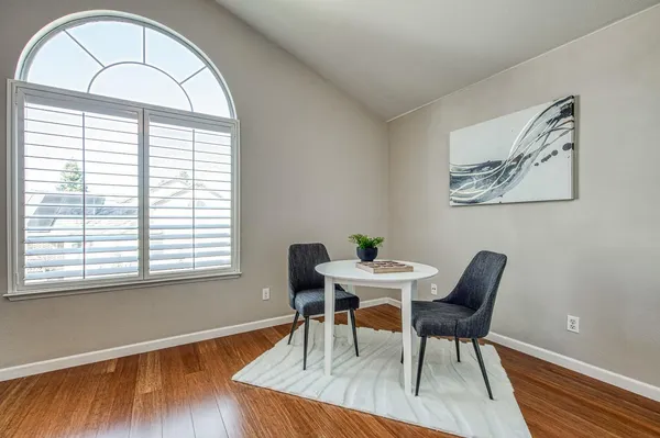 a bedroom with a bed and a lamp on table