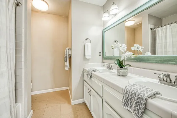 a view of a room with furniture and windows