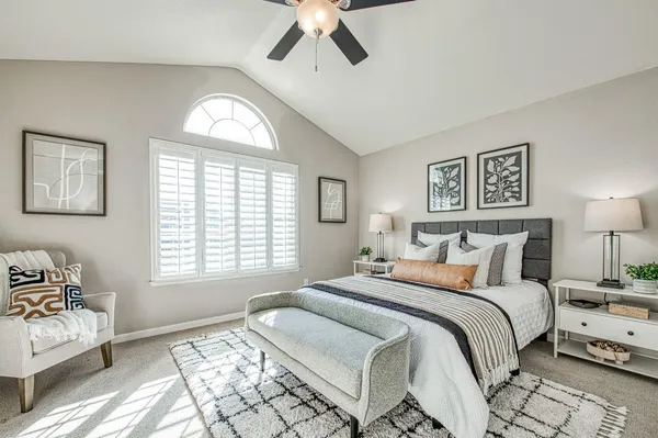 a view of a backyard with table and chairs with wooden fence
