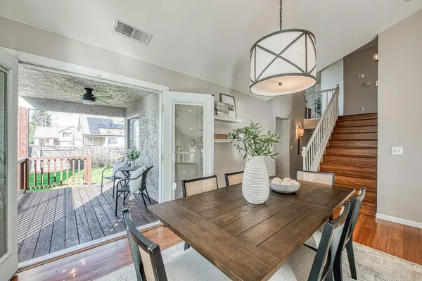 a bathroom with a tub and large windows