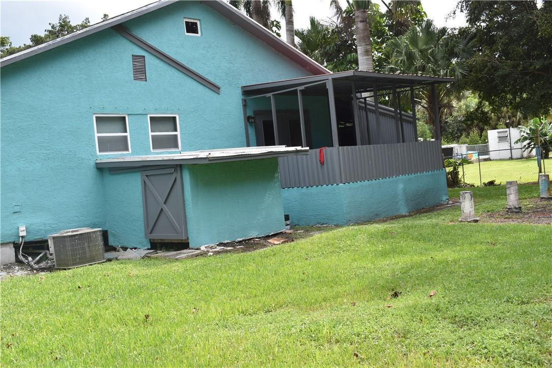 1991 Bacom Point Road Pahokee, FL 33476 - Photo 9 of 36 PATIO #1 AND STORAGE