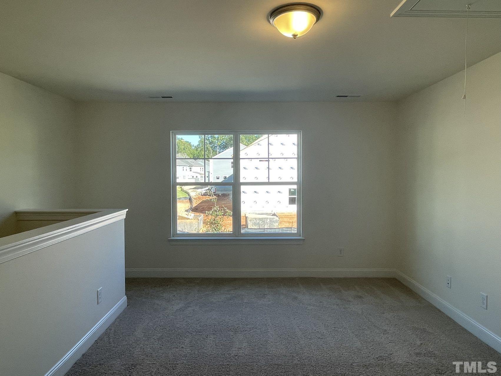 2205 Seneca Road Raleigh, NC 27604 - Photo 12 of 21 an empty room with a window