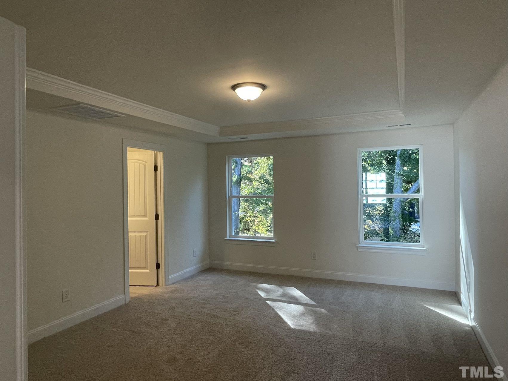 2205 Seneca Road Raleigh, NC 27604 - Photo 13 of 21 an empty room with windows