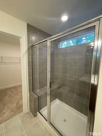 a bathroom with a shower and a bathtub