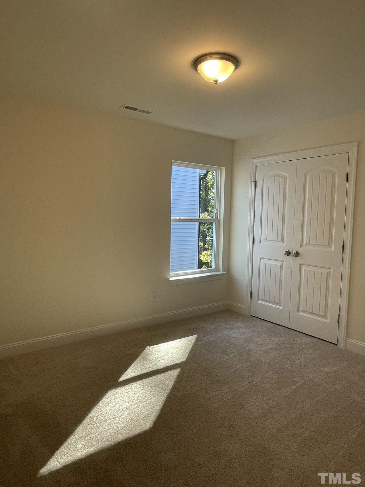 2205 Seneca Road Raleigh, NC 27604 - Photo 19 of 21 an empty room with windows