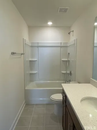 a bathroom with a sink a toilet and bathtub