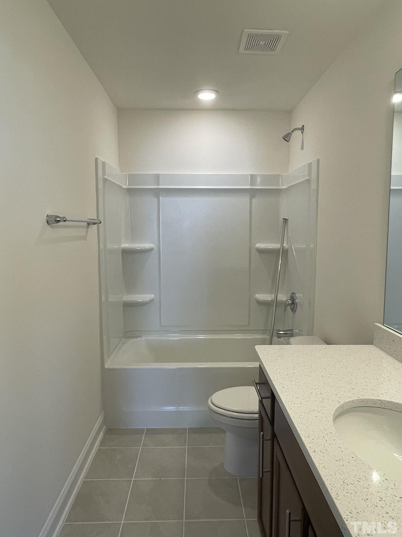 2205 Seneca Road Raleigh, NC 27604 - Photo 20 of 21 a bathroom with a sink a toilet and bathtub