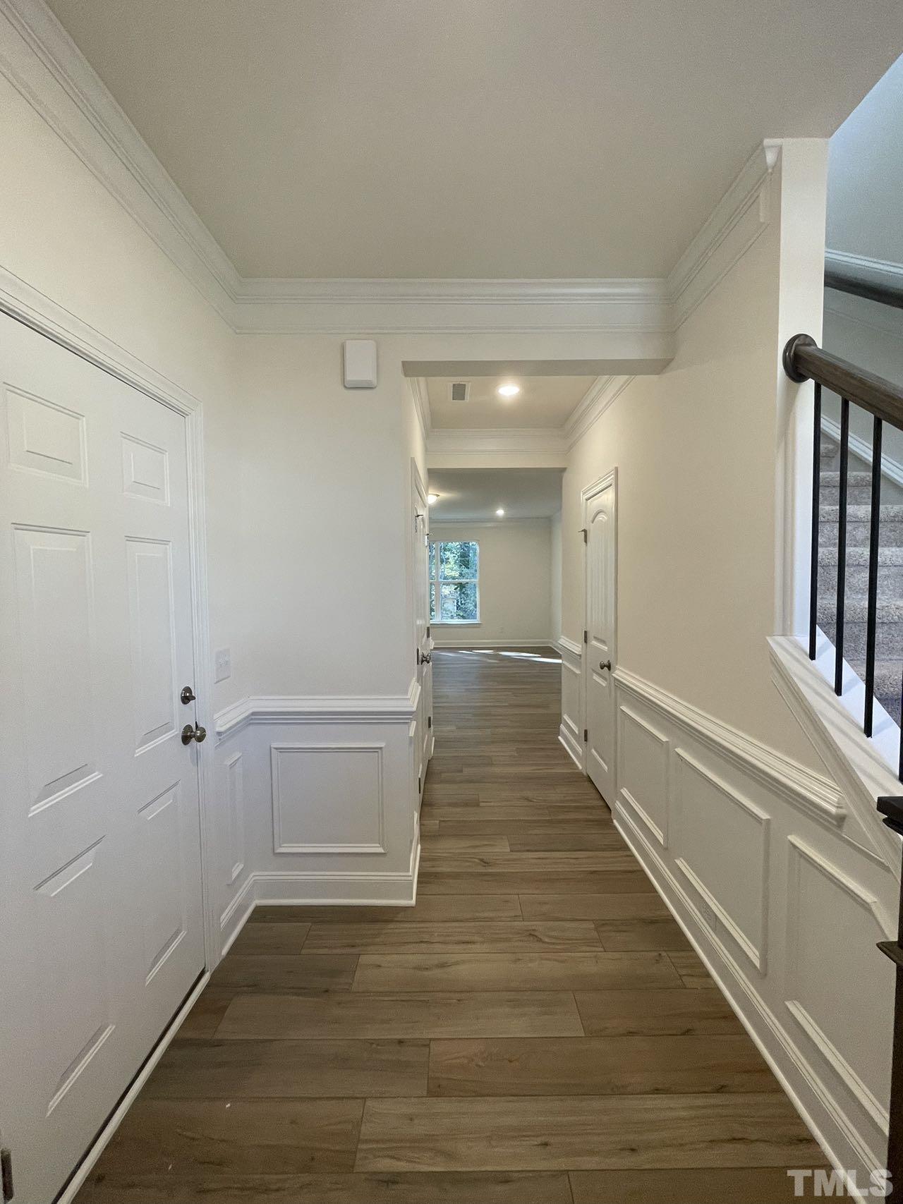2205 Seneca Road Raleigh, NC 27604 - Photo 4 of 21 a view of a hallway with wooden floor