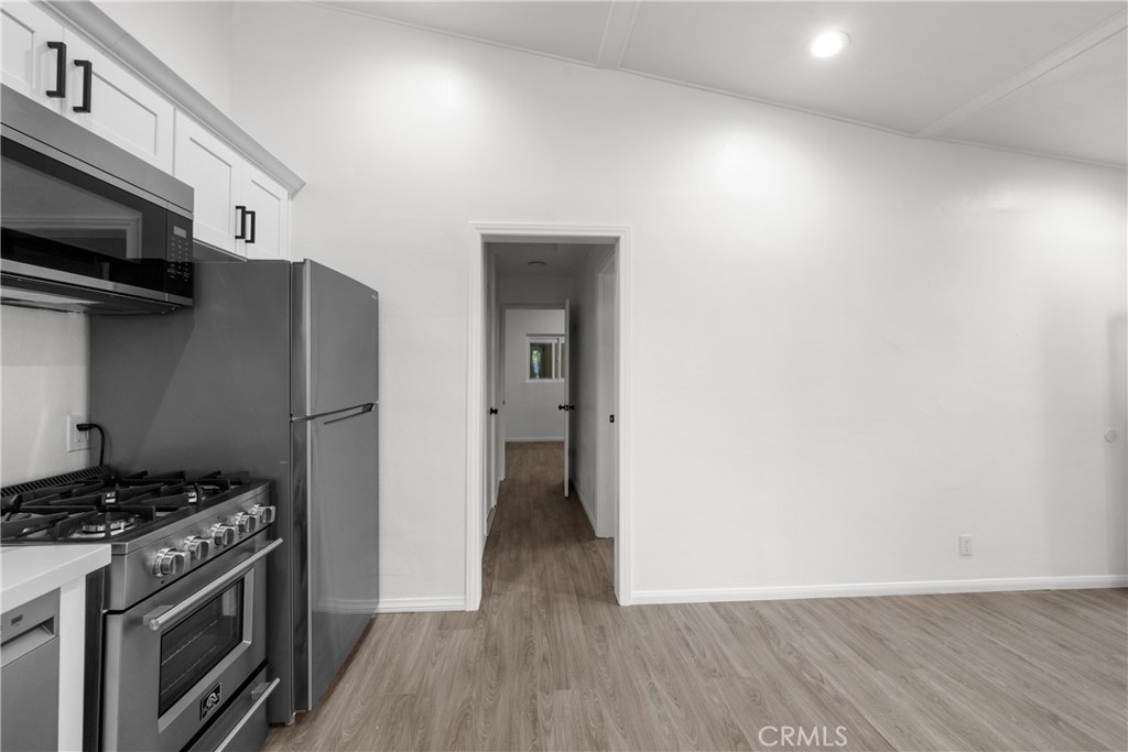 2603 Calle Del Comercio, Unit B San Clemente, CA 92672 - Photo 11 of 18 a stove top oven sitting inside of a kitchen