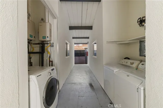 a view of hallway with washer and dryer