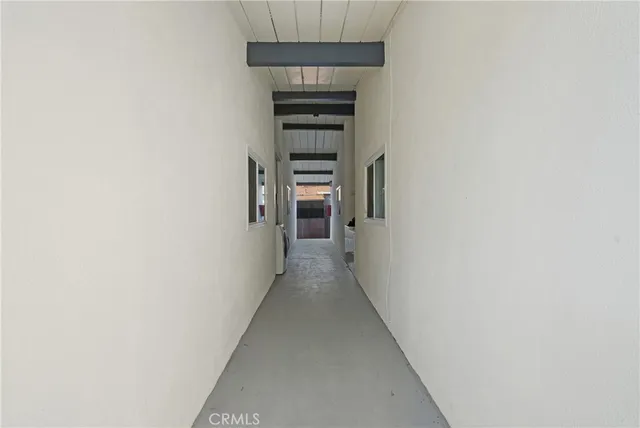 a view of a hallway with an empty room