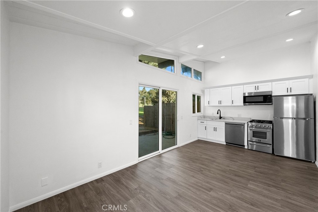 2603 Calle Del Comercio, Unit B San Clemente, CA 92672 - Photo 2 of 18 a large kitchen with stainless steel appliances a refrigerator and a stove top oven