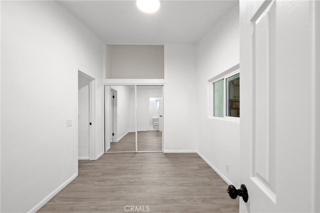 2603 Calle Del Comercio, Unit B San Clemente, CA 92672 - Photo 8 of 18 a view of an empty room with wooden floor