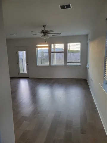 a kitchen with kitchen island cabinets and oven