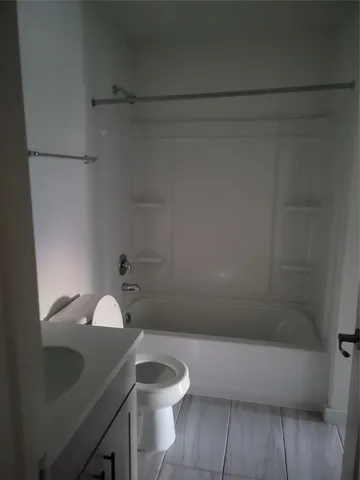 an empty room with a empty space and a window