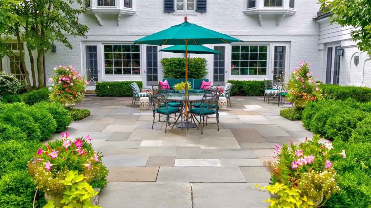 5 Woodley Road Winnetka, IL 60093 - Photo 12 of 48 a view of a patio with table and chairs and potted plants