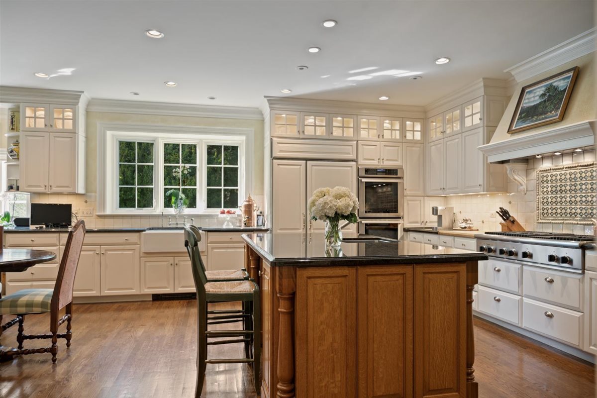 5 Woodley Road Winnetka, IL 60093 - Photo 16 of 48 a kitchen with counter top space cabinets and appliances