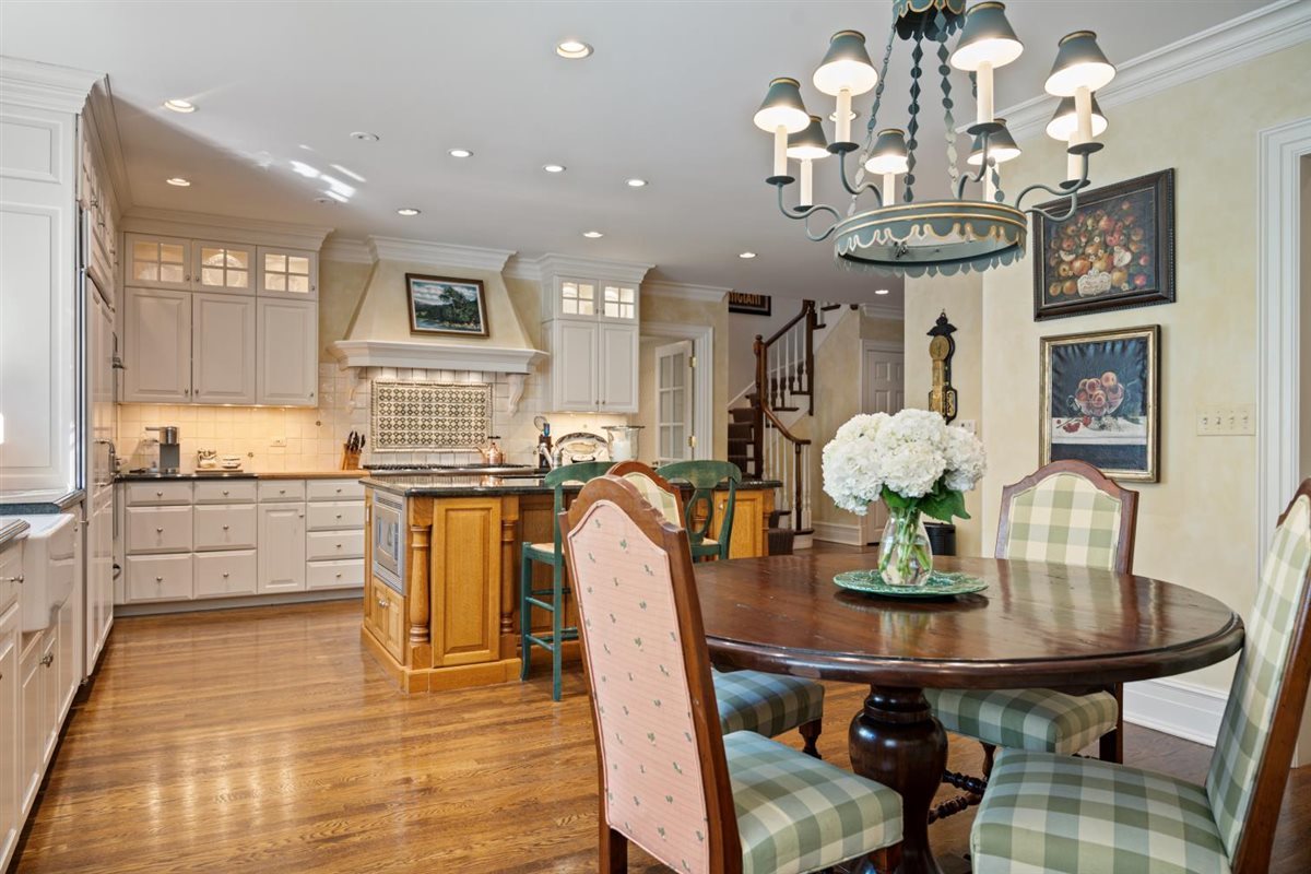 5 Woodley Road Winnetka, IL 60093 - Photo 17 of 48 a view of a dining room with furniture and chandelier
